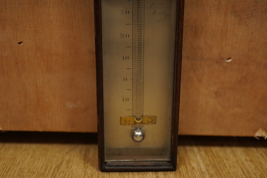 A George III mahogany cased thermometer by Ramsden, London, with silvered scale, height 46cm. Condition - poor to fair, the majority of the mercury now missing and reattachment needed to the top of the case.